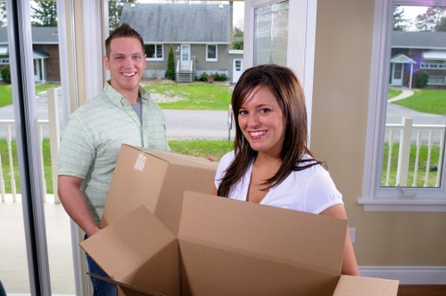 Family home move in Dulwich with boxes, furniture, and careful stairway handling